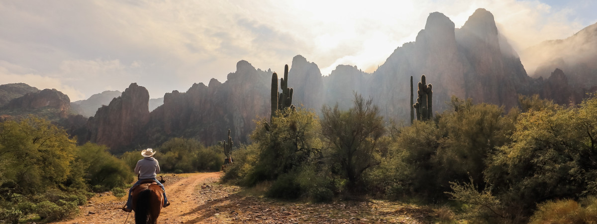 Horseback riding toward the Bulldog Cliffs at Saguaro Lake Guest Ranch