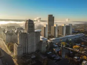 The Alfred E. Smith State Office Building, left, is seen with the Empire State Plaza and State Capitol as fog covers the Hudson River in Albany  | The Alfred E. Smith State Office Building, left, is seen with the Empire State Plaza and State Capitol as fog covers the Hudson River in Albany |   – © Mike Groll